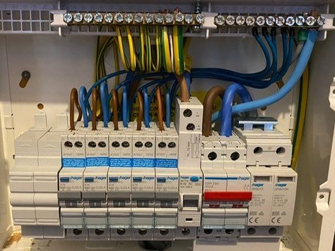Inside view of a domestic consumer unit (fuse box) fitted by KF Watson showing switches and wiring