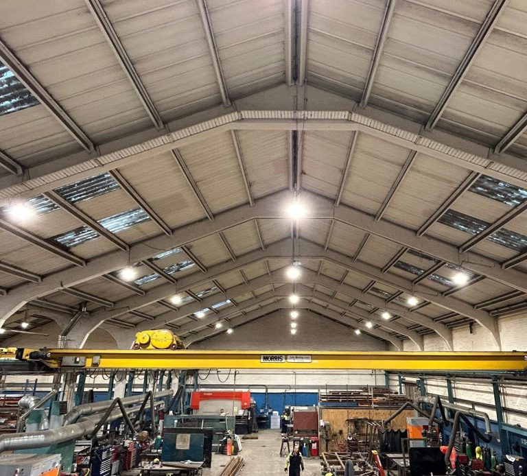Commercial ceiling mounted lighting in a large industrial unit