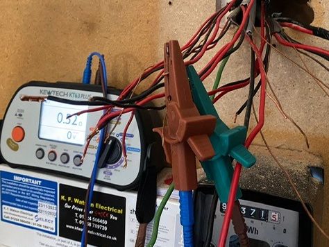 Electrical testing equipment (KT63PLUS multifunction tester) being used by the KF Watson team to check wiring installation